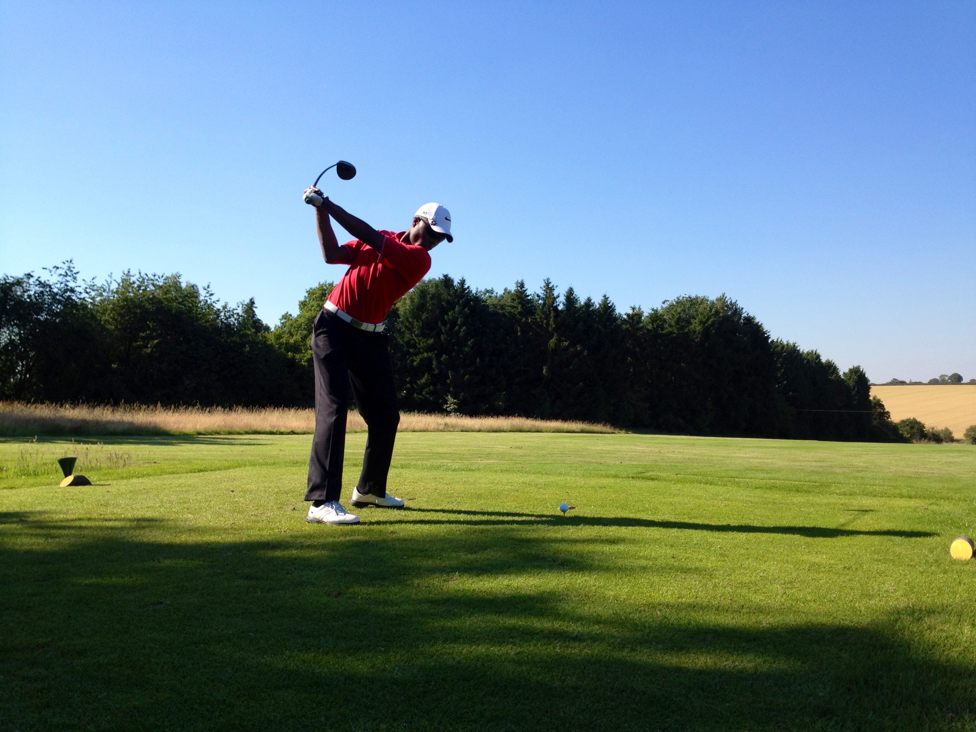 Jabu at the top of his backswing with a driver - the swing of a 12-handicap golfer years on from his first round